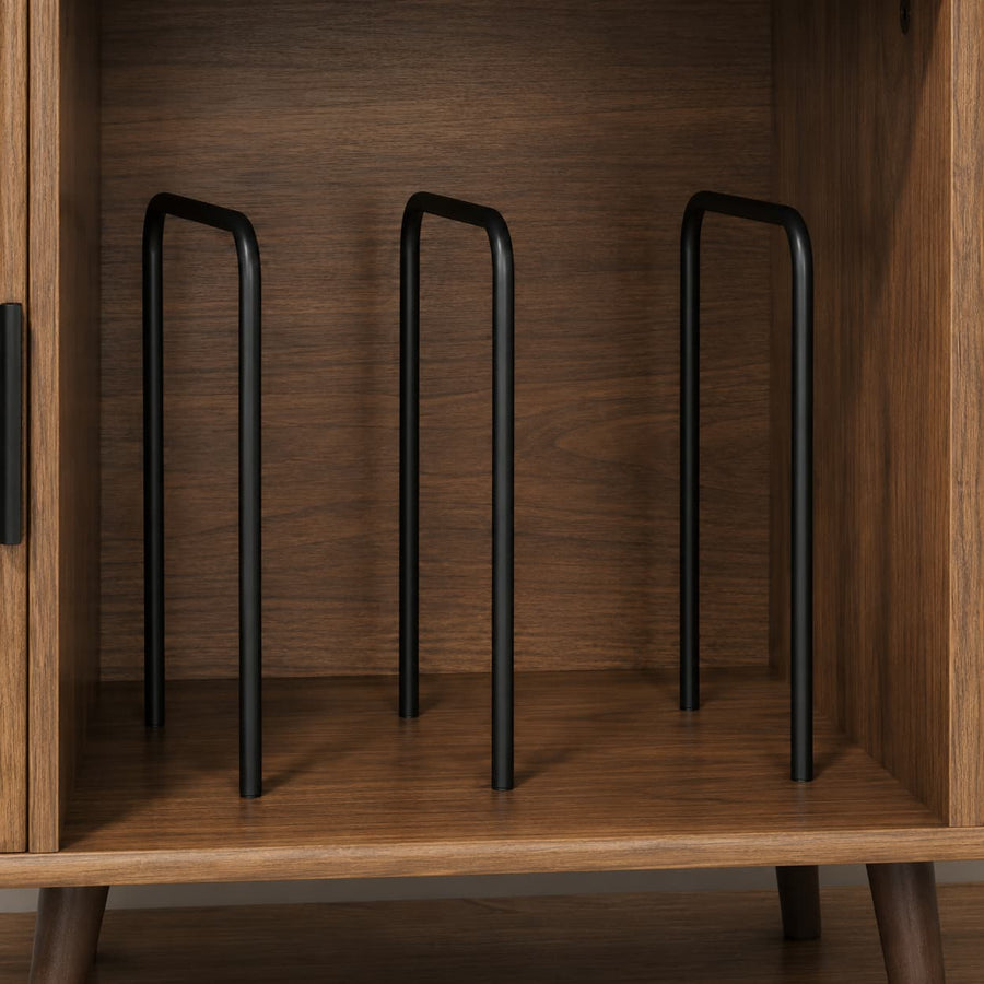 Three matte black metal cabinet organizer racks installed inside a wooden cabinet.