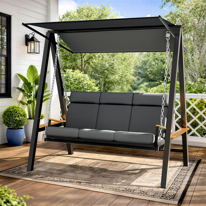 Pamapic Forge 3-seat patio swing with canopy in a backyard setting